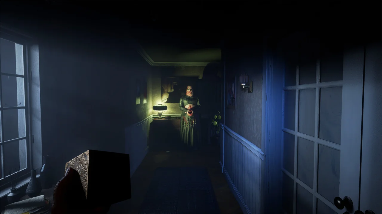 A dimly lit Labyrinth corridor in Clive Barker's Hellraiser: Revival lit by a single warm light source.
